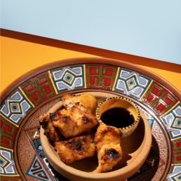 chicken on a plate with soy sauce